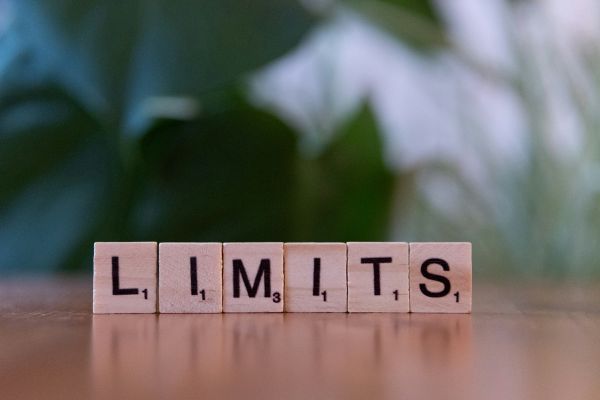 take the limits off devotional cover image with wooden blocks with black text that says "limits"